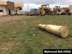 Unexploded ammunition lies in village near Kobani. Credit: Mahmoud Bali.