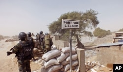 FILE - Cameroon soldiers stand guard at a lookout post as they take part in operations against the Islamic extremists group Boko Haram.