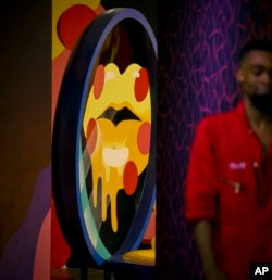 A three-dimensional sculpture from artist Shawna X called "Say Cheese," is part of a group art exhibition celebrating pizza at The Museum of Pizza in New York, Nov. 2, 2018.