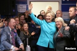 U.S. Democratic presidential nominee Hillary Clinton greets people at a campaign office in Seattle, Washington, Oct. 14, 2016.