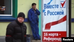 A poster calling for people to vote in the upcoming referendum is seen in Simferopol March 11, 2014.