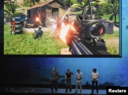 Ubisoft staff demonstrate the "Far Cry 3" video game during a news conference in Los Angeles, California 2012. (REUTERS/Gus Ruelas)