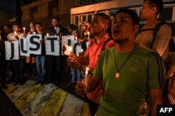 Opponents of Venezuelan president Nicolas Maduro demonstrate in front of the building of the intelligence service, SEBIN, where the opposition councilor Fernando Alban allegedly committed suicide, in Caracas, Oct. 8, 2018.