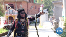 A local artist spreads the message about following COVID protocols in Kangra district in India’s Himachal Pradesh state.