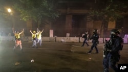 Federal officers advance on members of the "Wall of Moms" group during a Black Lives Matter protest at the Mark O. Hatfield United States Courthouse July 29, 2020, in Portland, Ore. 