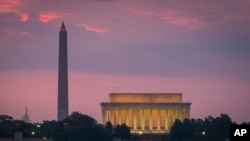 FILE - A view of the Capitol Dome, Washington Monument and Lincoln Memorial in Washington, D.C. on June 21, 2014. (AP Photo/J. David Ake)