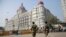 Indian police officers walk outside the Taj Mahal Hotel, one of the sites of the Mumbai terror attacks on its ninth anniversary in Mumbai, India, Nov. 26, 2017. The attack by Pakistani gunmen in India's financial capital on Nov. 26, 2008 killed 166 people.