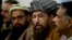 FILE - Pakistani religious cleric, Sami-ul-Haq, second right, addresses a news conference with, Hameed Gul, former chief of Pakistan's intelligence, left, in Islamabad, Pakistan, Feb. 3, 2014.