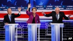 From left, Democratic presidential candidates, former New York City Mayor Mike Bloomberg, Sen. Elizabeth Warren, D-Mass., Sen. Bernie Sanders, I-Vt., participate in a Democratic presidential primary debate Feb. 19, 2020, in Las Vegas.