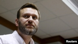 FILE - Russian anti-corruption campaigner and prominent opposition figure Alexei Navalny is seen attending a hearing at the Moscow City Court in Moscow, Russia, Feb. 12, 2016. 