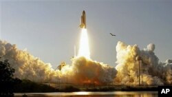 Space shuttle Discovery - the world's most traveled spaceship - thunders into orbit for the final time as it heads toward the International Space Station on a journey that marks the beginning of the end of the shuttle era, at the Kennedy Space Center in C