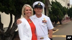 Navy Special Operations Chief Edward Gallagher embraces his wife, Andrea Gallagher, after leaving a military courtroom on Naval Base San Diego, May 30, 2019, in San Diego. 