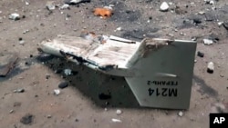 FILE - This undated photograph released by the Ukrainian military's Strategic Communications Directorate shows the wreckage of what Kyiv has described as an Iranian Shahed drone downed near Kupiansk, Ukraine. 