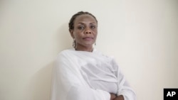 Sudanese activist Khalda Saber, poses for a photograph at her apartment, in Cairo, Egypt, Sept. 4, 2019.