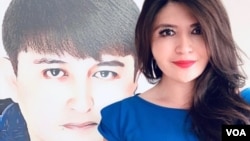 资料照：大西洋理事会高级研究员莱汉·阿萨特(Rayhan Asat)和她的兄弟。