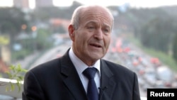 FILE - Issad Rebrab, president and owner of Algerian food processing company Cevital, speaks during an interview with Reuters in Abidjan, June 8, 2012. 