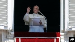 Pope Francis recites the Regina Coeli prayer from his studio's window overlooking St. Peter's Square at the Vatican, Sunday, May 28, 2017.