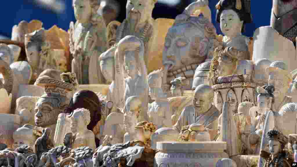 Decorative carved ivory was piled high for destruction at the National Wildlife Property Repository at Rocky Mountain Arsenal National Wildlife Refuge in Commerce City, Colorado in November, 2013. It was a first public step to curb the U.S. love of ivory piano keys, letter openers, chess pieces and jewelry.