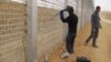 African migrants work at the site where Israel builds a barrier along the border with Egypt in southern Israel, February 15, 2012.