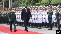 U.S. Secretary of Defense Lloyd Austin with Vietnamese Defense Minister Phan Van Giang, left, inspects an honor guard in Hanoi, Vietnam, Thursday, July 29, 2021. 