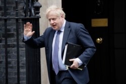 British Prime Minister Boris Johnson leaves 10 Downing Street in London, Feb. 12, 2020.