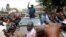 Kenyan opposition leader Raila Odinga, of the National Super Alliance (NASA) coalition, waves to supporters as he leaves the St. Stephen's cathedral after attending a church service in Nairobi, Sept. 3, 2017.