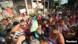 People queue to receive food donations in Juchitan after an earthquake that struck on the southern coast of Mexico, Sept. 9, 2017. 