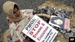 A women poses during a demonstration of the National Council of Resistance of Iran against stoning and death penalty in Berlin, Germany (File)