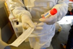 FILE - A test kit for testing for COVID-19 is seen at Newton-Wellesley Hospital in Newton, Massachusetts, March 18, 2020.