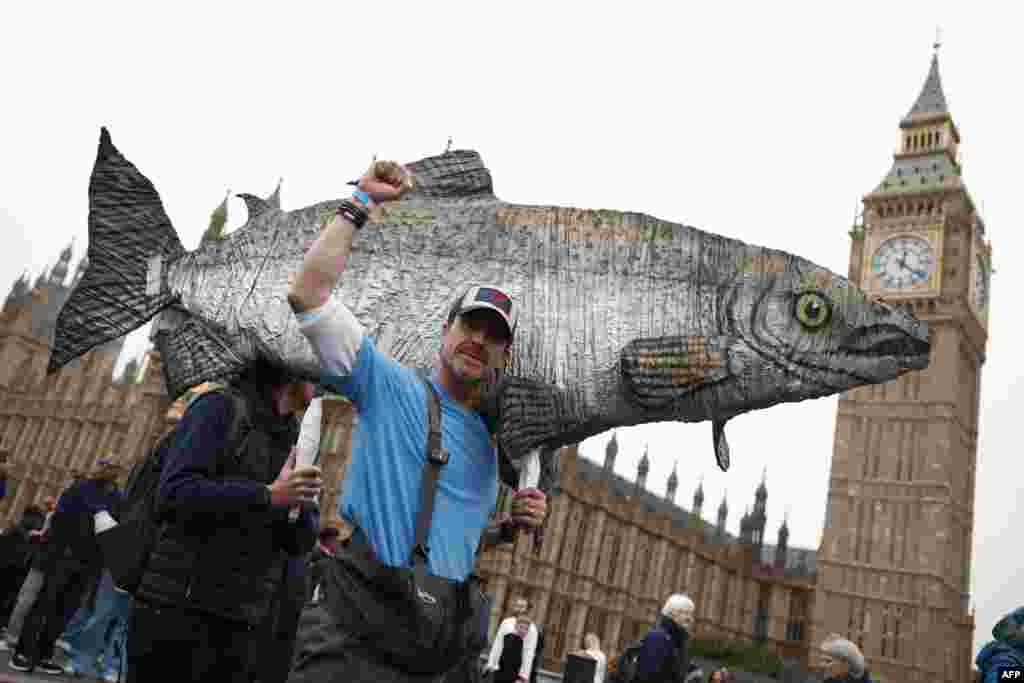 Protesters attend a &quot;March for Clean Water&quot; in London, calling for the government to &quot;stop the poisoning of Britain&#39;s waters.&quot;