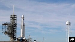 FILE - A Falcon 9 SpaceX heavy rocket stands ready for launch on pad 39A at the Kennedy Space Center in Cape Canaveral, Fla., Feb. 5, 2018.