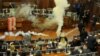 Kosovo opposition politicians release tear gas in parliament to obstruct a session in Pristina, Kosovo, March 21, 2018.