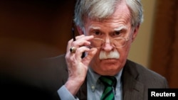 FILE - Then-national security adviser John Bolton is pictured during an Oval Office meeting at the White House in Washington, April 2, 2019.