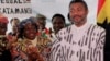 FILE - Nana Konadu Agyeman-Rawlings (L), then first lady of the Republic of Ghana and her husband, then president of Ghana Jerry John Rawlings, are seen during a visit to Denver, Colorado, in an April 24, 1999, photo.