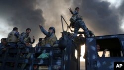 ផ្សែង​នៅ​ទីតាំង​របស់​ពួក​រដ្ឋ​ឥស្លាម​ បន្ទាប់​ពី​រង​ការ​វាយ​លុក​ពី​កងកម្លាំង​ចម្រុះ​ នៅ​ទីក្រុង​ Mosul កាល​ពី​ថ្ងៃទី​១៨ ខែ​តុលា។