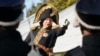 FILE - Oleg Sokolov, a history professor at St. Petersburg State University, wears a 1812-era French army general's uniforms during a staged battle re-enactment to mark the 200th anniversary of the battle of Borodino, Sept. 16, 2012.