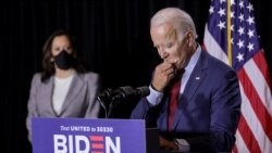 FILE PHOTO: Democratic presidential candidate Biden and vice presidential candidate Harris face reporters at campaign event in Wilmington, Delaware