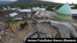FILE - An aerial view of the collapsed Jamiul Jamaah mosque where rescue workers and soldiers search for earthquake victims in Pemenang, North Lombok, Indonesia, Aug. 8, 2018. (Antara Foto/Zabur Karuru/ via Reuters)