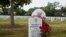 FILE - Waverly Woodson Jr. is buried at Arlington National Cemetery in Virginia, where America buries its heroes. Each May around Memorial Day, his widow, Joann, arranges the red roses her husband loved so much beside his grave. (Photo: Linda Hervieux)
