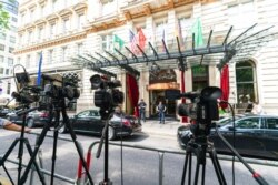 FILE - TV cameras are set up in front of the Grand Hotel Vienna, where closed-door nuclear talks take place in Vienna, Austria, June 20, 2021.