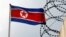 FILE - A North Korea flag flutters next to concertina wire at the North Korean embassy in Kuala Lumpur, Malaysia March 9, 2017.