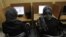 Iranian women use computers at an Internet cafe in central Tehran, Iran on Feb. 13, 2012. Many Iranian users are reporting Gmail and other Google products have been blocked.