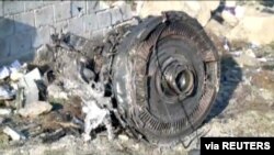FILE - An engine from Ukraine International Airlines Flight PS752, which was shot down after taking off from Tehran's Imam Khomeini airport on Jan. 8, 2020, is seen in this image from Iran Press footage. (Iran Press via Reuters)