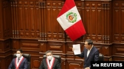 Peru's President Martin Vizcarra addresses Congress as lawmakers were set to vote over whether to oust Vizcarra after impeachment proceedings were launched last week, in Lima, Peru, Sept. 18, 2020. 