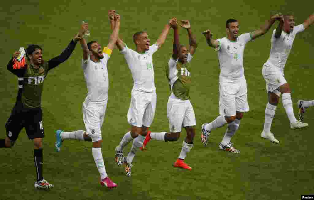 From left: Algeria's Mohamed Lamine Zemmamouche, Rafik Halliche, Nabil Bentaleb, Yacine Brahimi, Essaid Belkalem and Sofiane Feghouli celebrate their win over South Korea at the Beira Rio stadium in Porto Alegre, June 22, 2014.