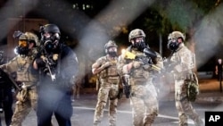 Federal agents disperse Black Lives Matter protesters near the Mark O. Hatfield United States Courthouse in Portland, Oregon, July 20, 2020.