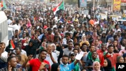 Sudanese protesters march during a demonstration in Khartoum, Sudan, Thursday, Aug. 1, 2019. 