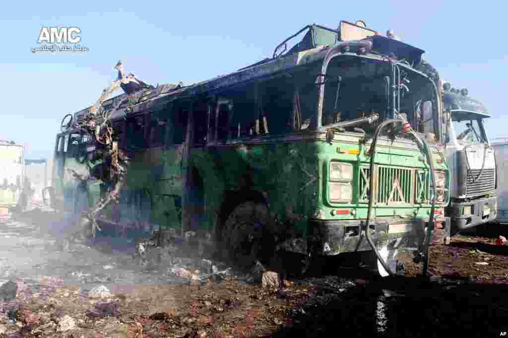 This citizen journalism image shows damages of a burned bus after a Syrian air strike in Aleppo, Dec. 22, 2013.