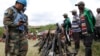 FILE - United Nations peace keepers record details of weapons recovered from the Democratic Forces for the Liberation of Rwanda (FDLR) militants after their surrender in Kateku,in Democratic Republic of Congo, May 2014.