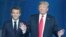 FILE — French President Emmanuel Macron, left, walks with former U.S. President Donald Trump at NATO headquarters in Brussels, July 11, 2018. During a town hall meeting last week, Trump refused to commit to U.S. membership of NATO if elected to a second term.